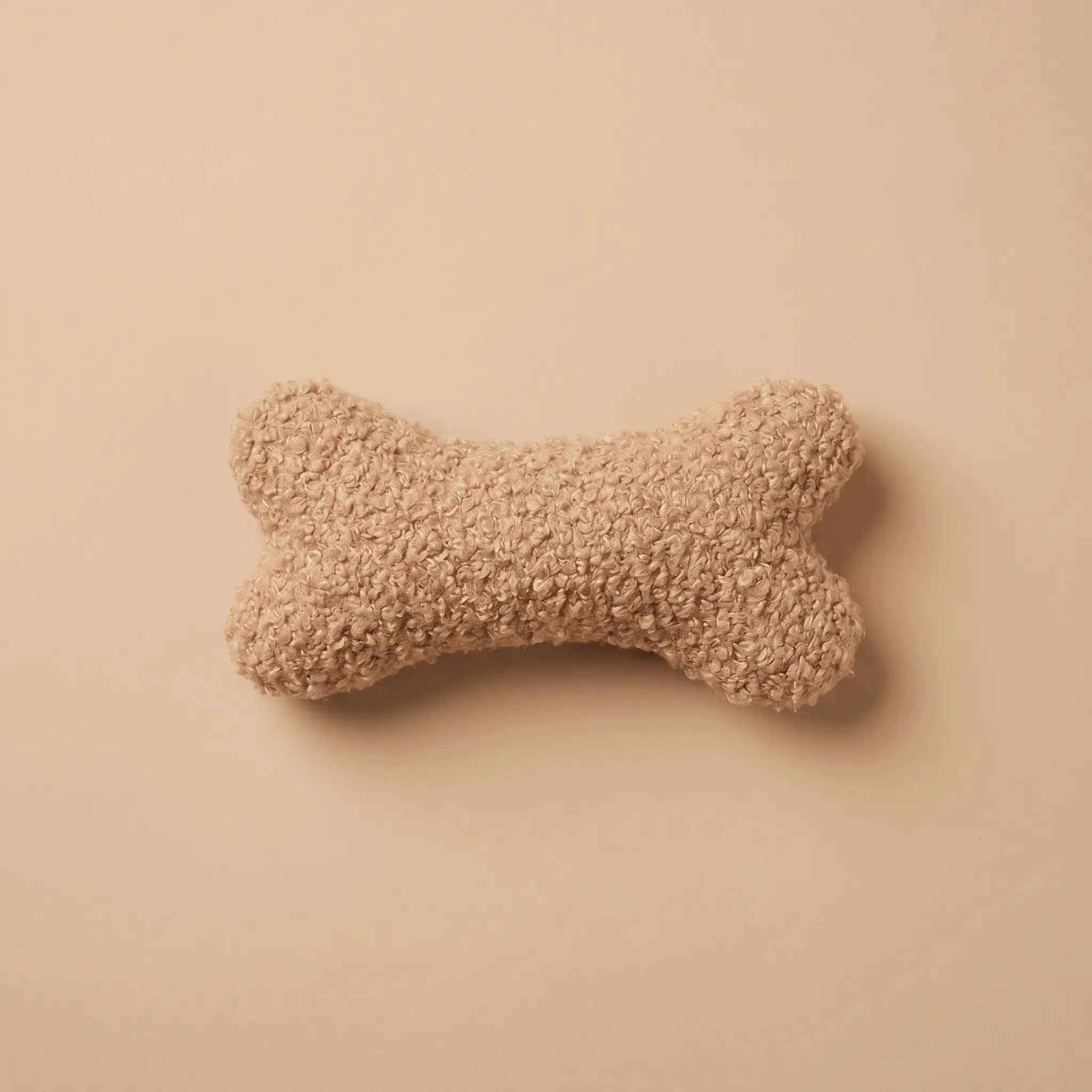 Peluche doudou en forme d'os tissu teddy doux et moelleux pour chien